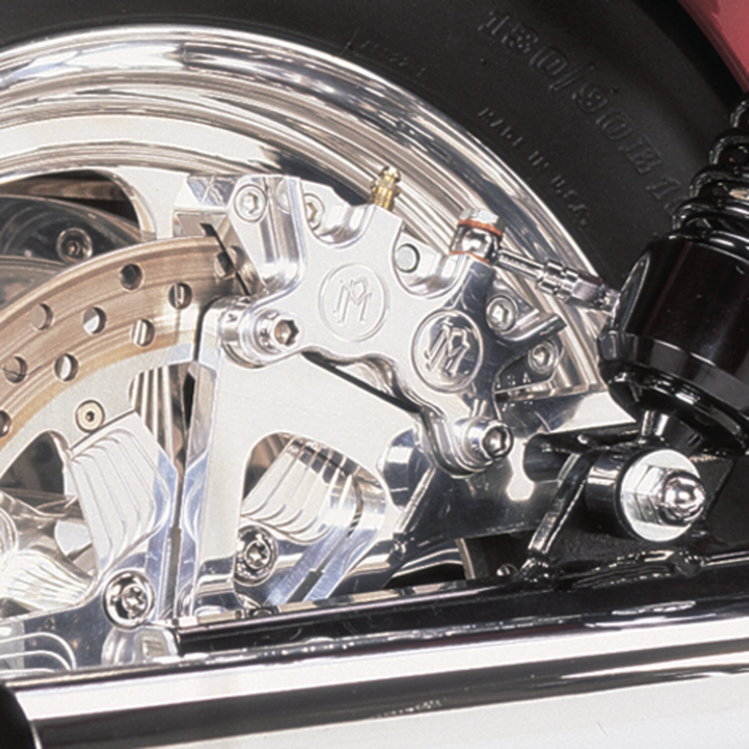 PM, Rear 4-p caliper bracket, 11.5". Chrome 00-05 Dyna (NU)