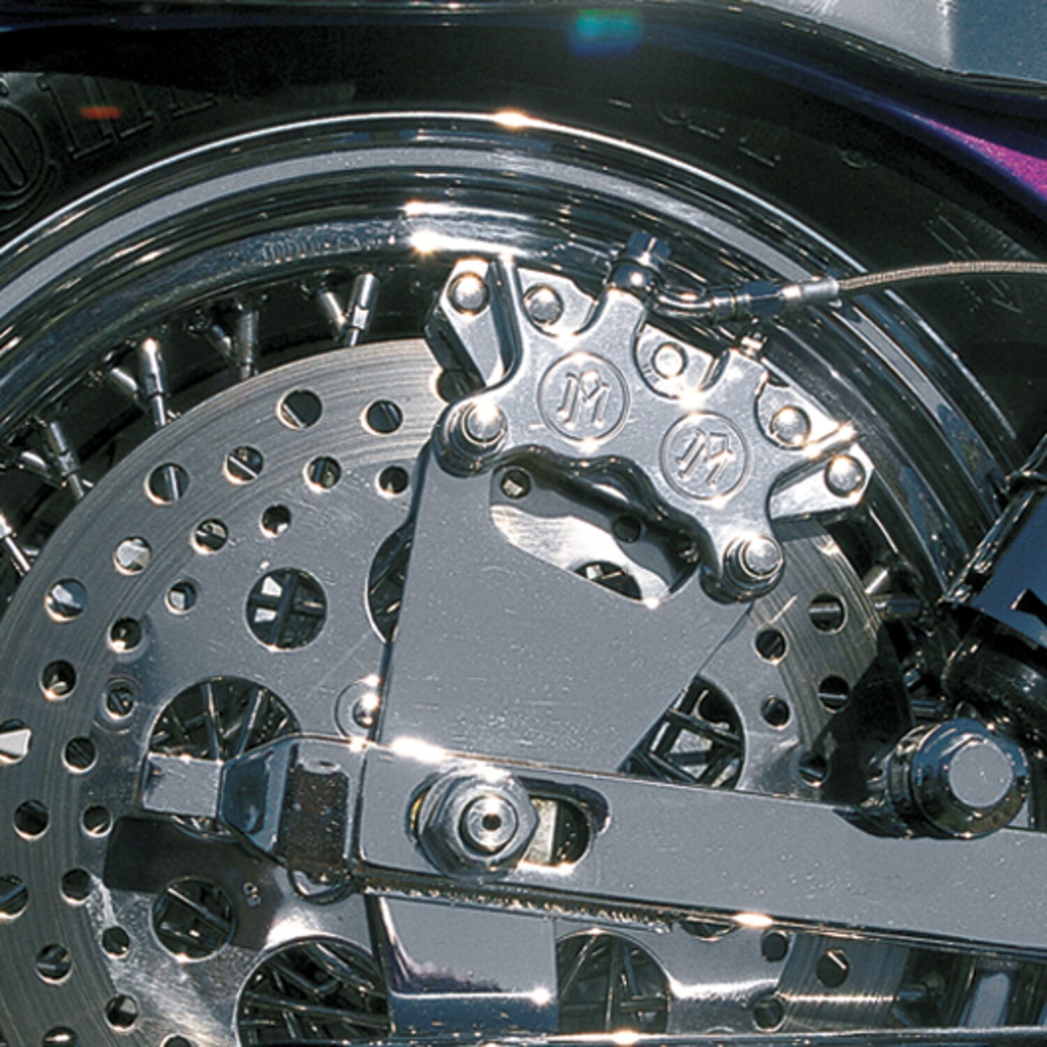 PM, rear 4-p caliper bracket, 10". Chrome 73-86 4-speed FL; FX (Excl. FLT/Touring; FXR); Custom applications with 10"